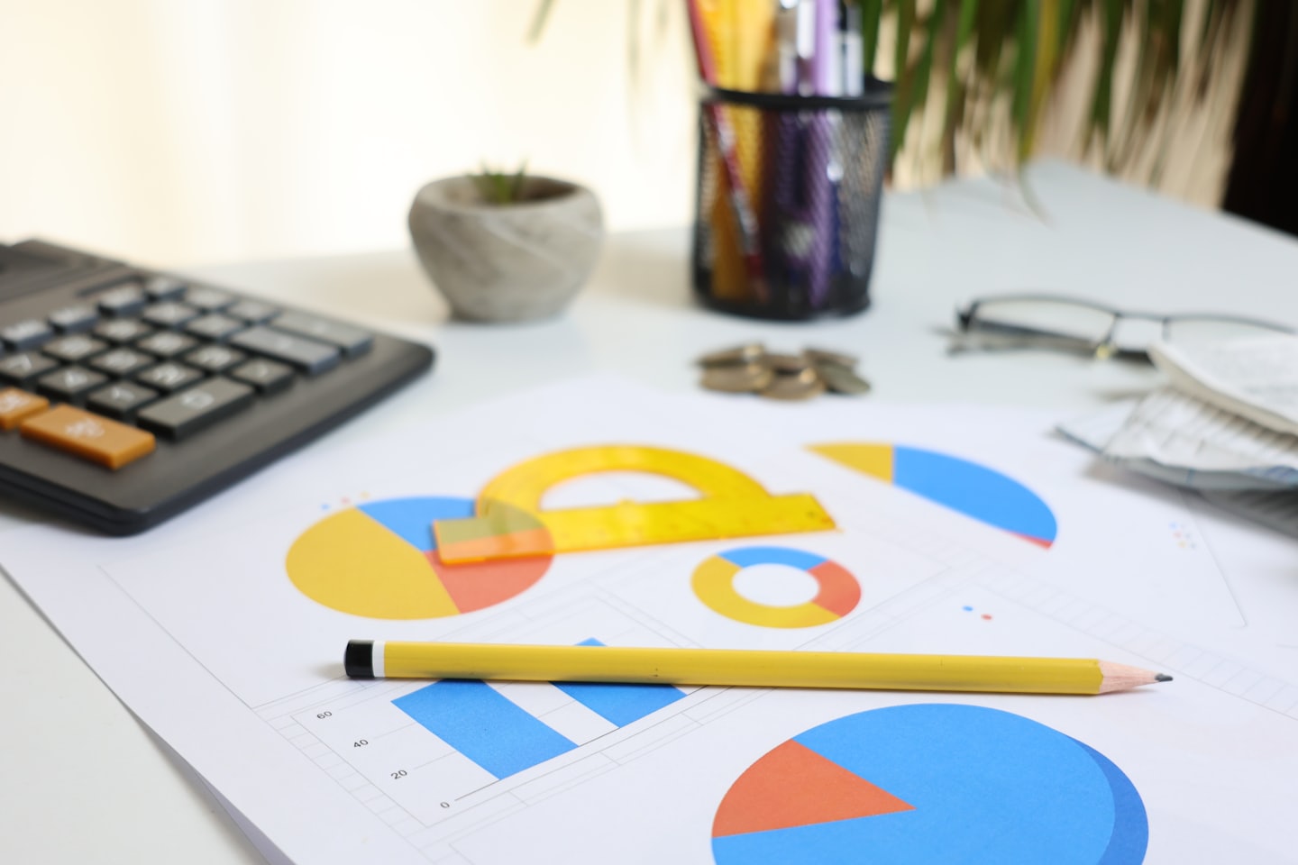 Desk with financial documents and office supplies for planning.